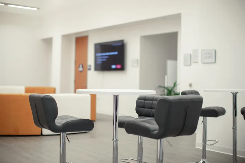 The main lounge with curved seating at Arision Treatment Center in Woodland Hills