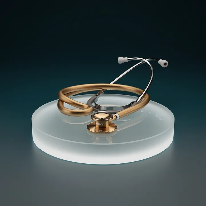 A gold stethoscope on a glass plinth