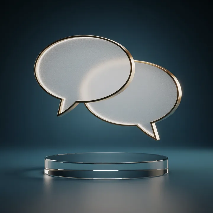 Two glass speech bubbles with gold rims